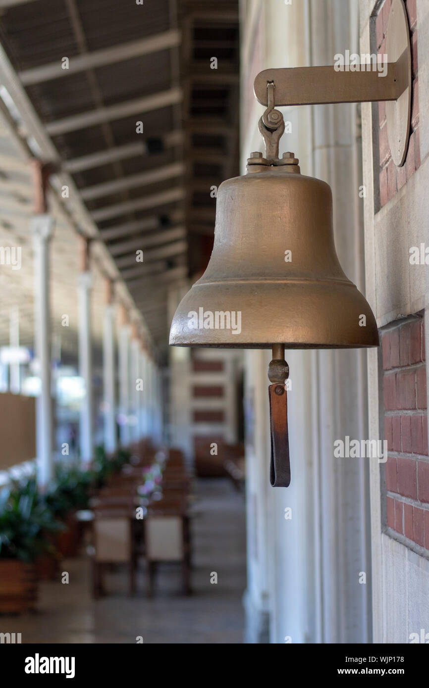 Yellow bell at the railway station. Old history. Taken from the side Stock Photo