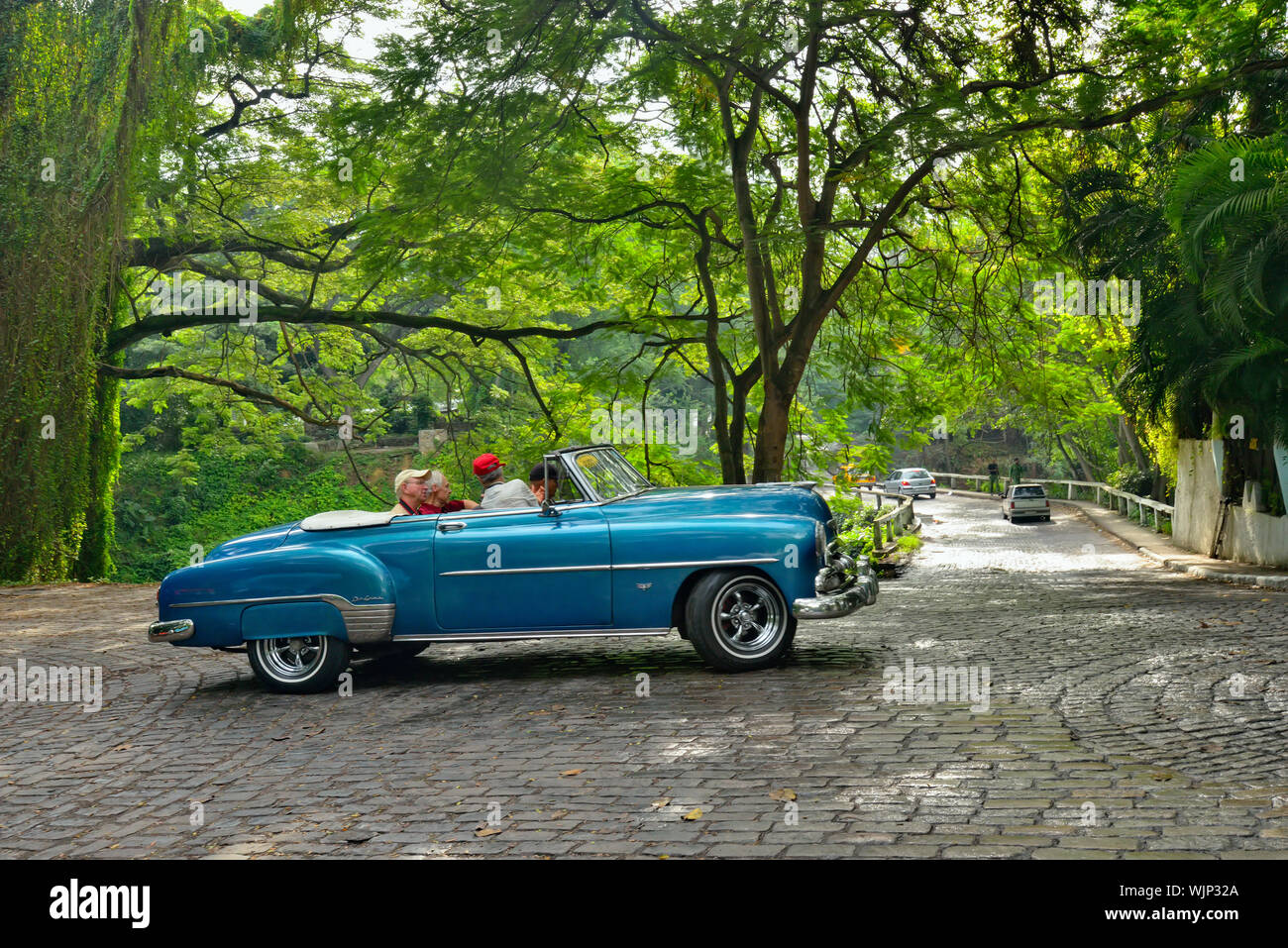 Street photography in central Havana- Restored vintage vehicle in city park, La Habana (Havana), Habana, Cuba Stock Photo