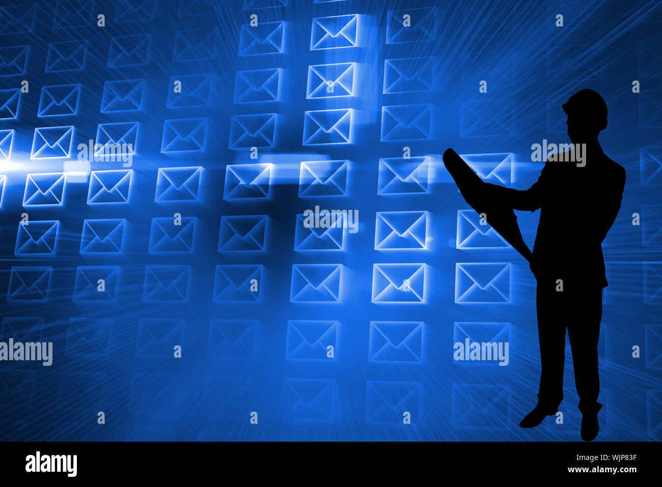 Composite image of glowing envelopes on blue background Stock Photo