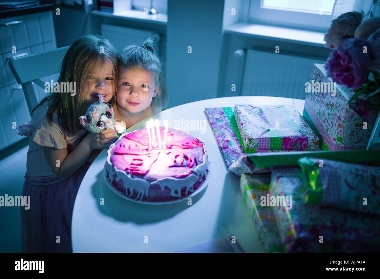 Two Girls With Birthday Cake Stock Photo - Alamy