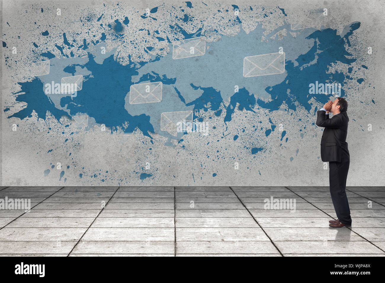 Shouting businessman against splash showing global communications Stock Photo