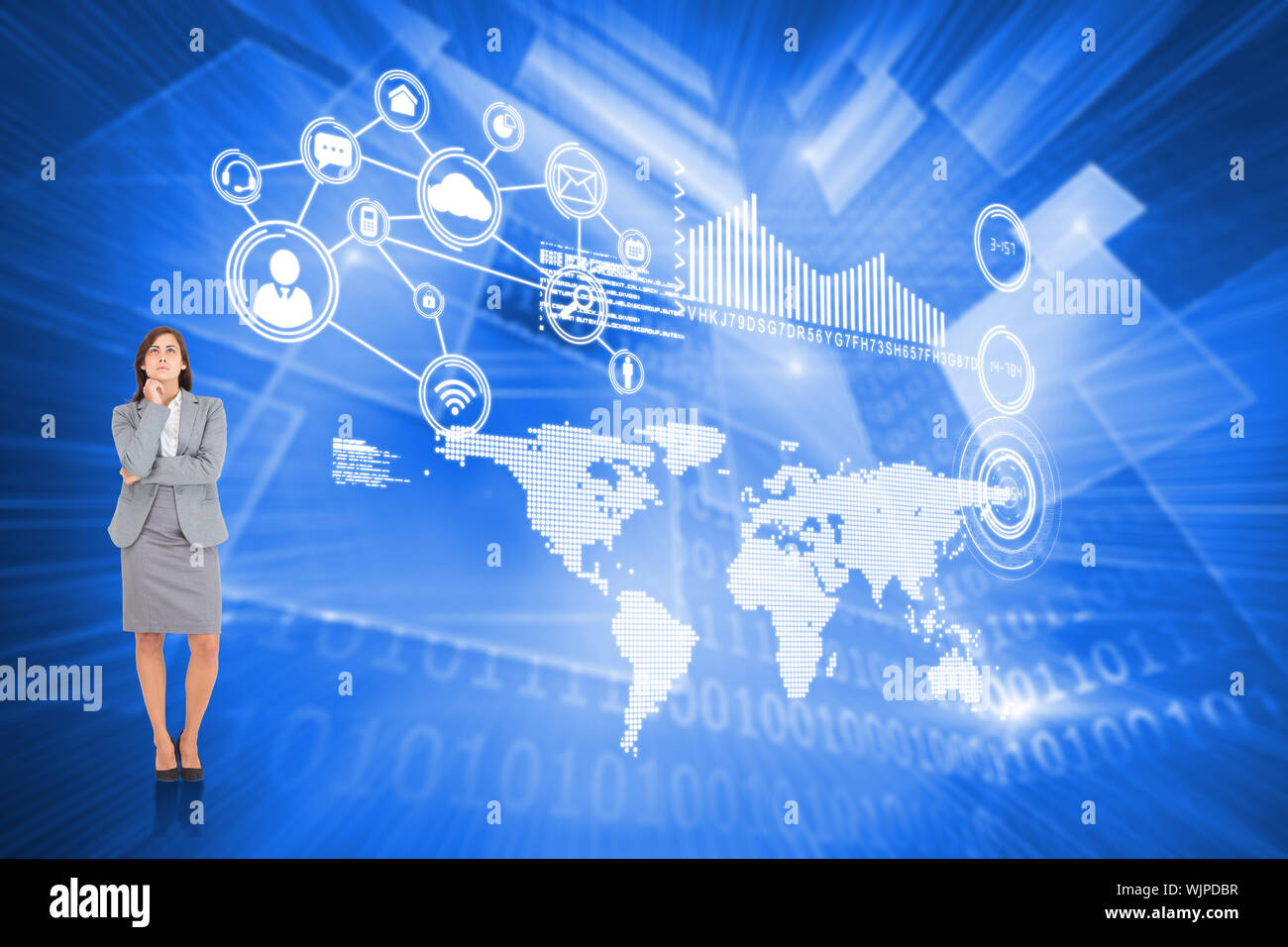 Focused businesswoman against shiny technological background Stock Photo