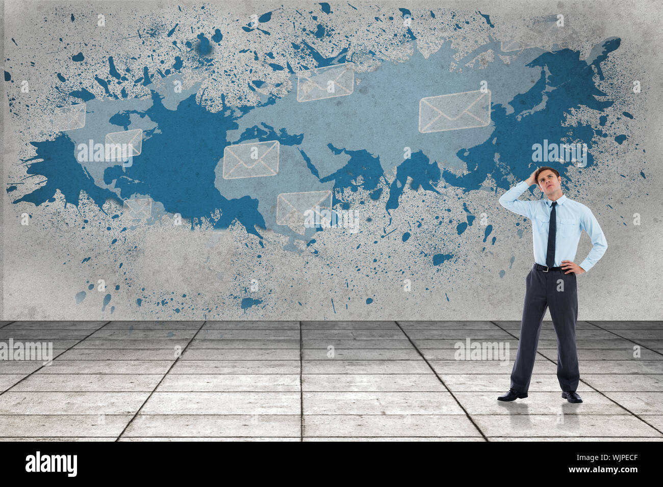 Thoughtful businessman with hand on head against splash showing global communications Stock Photo