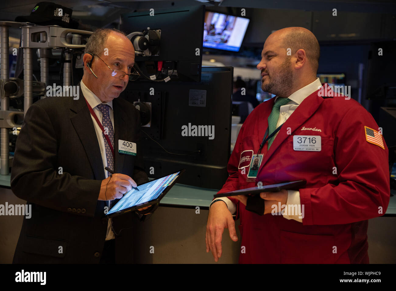 New York, USA. 3rd Sep, 2019. Traders work at the New York Stock Exchange in New York, the United States, on Sept. 3, 2019. U.S. stocks closed lower on Tuesday. The Dow Jones Industrial Average fell 285.26 points, or 1.08 percent, to 26,118.02. The S&P 500 was down 20.19 points, or 0.69 percent, to 2,906.27. The Nasdaq Composite Index fell 88.72 points, or 1.11 percent, to 7,874.16. Credit: Guo Peiran/Xinhua/Alamy Live News Stock Photo