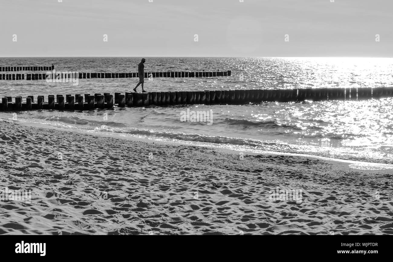 Man Walking Side View Sunlight Black and White Stock Photos & Images ...