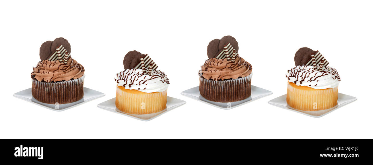 Chocolate and vanilla giant cupcakes on square plates isolated on white. Social media banner format Stock Photo