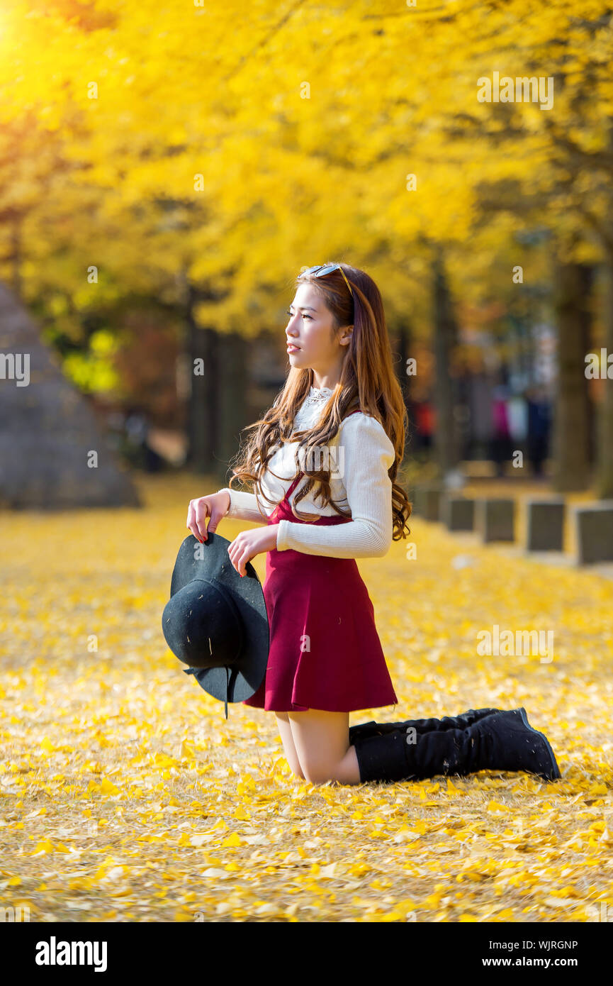 Woman kneeling outdoors hi-res stock photography and images - Alamy