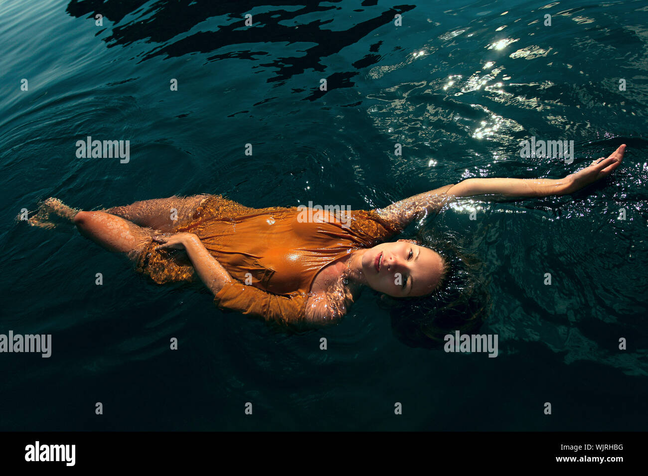 Woman swimming in water hi-res stock photography and images - Alamy