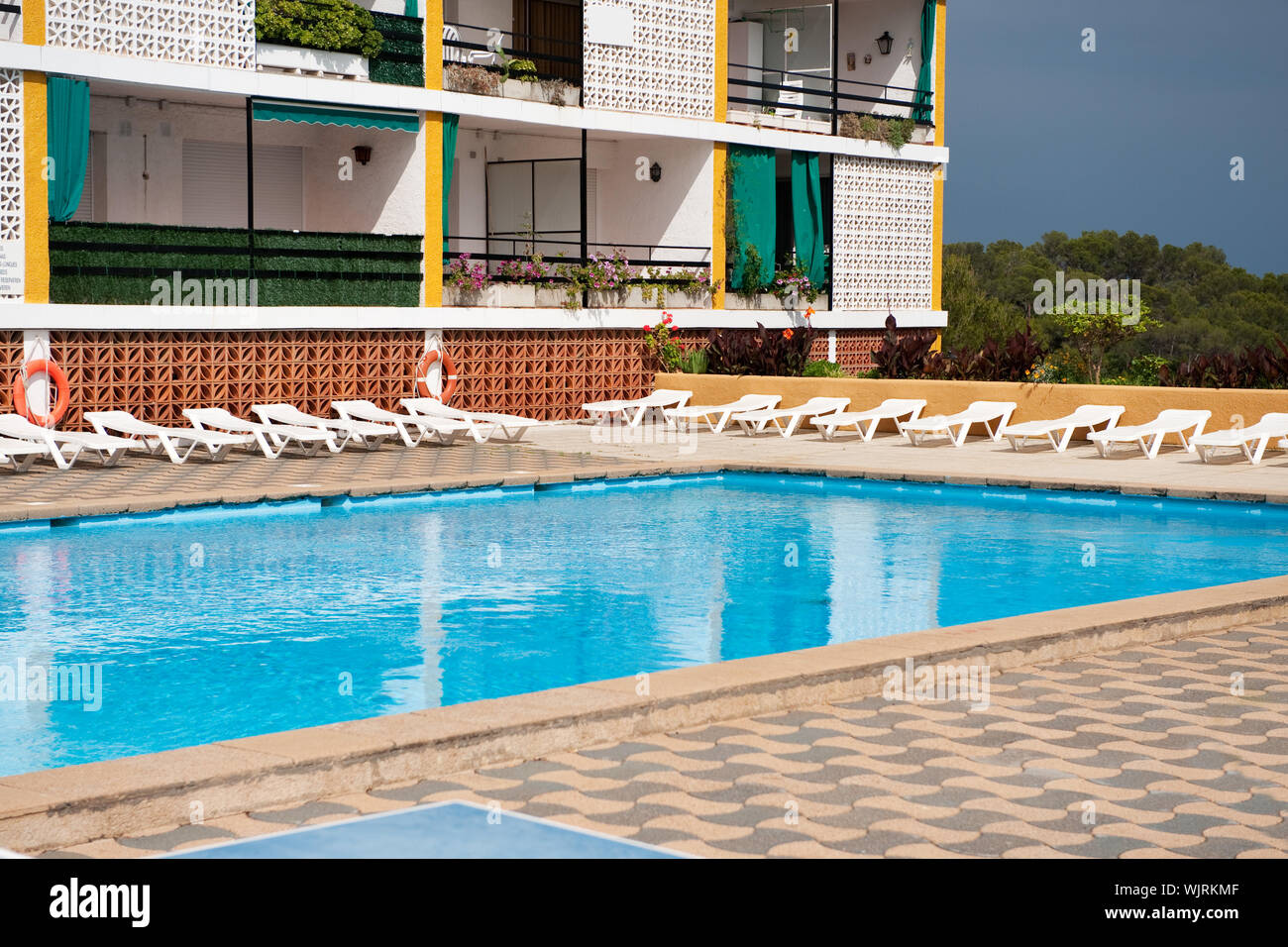 Picture of Luxury swimming pool with beds near the apartments Stock Photo - Alamy