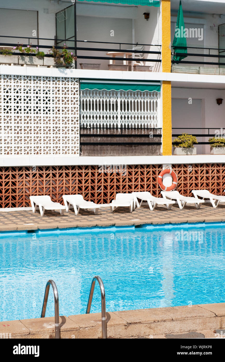 Picture of Luxury swimming pool with beds near the apartments Stock Photo - Alamy