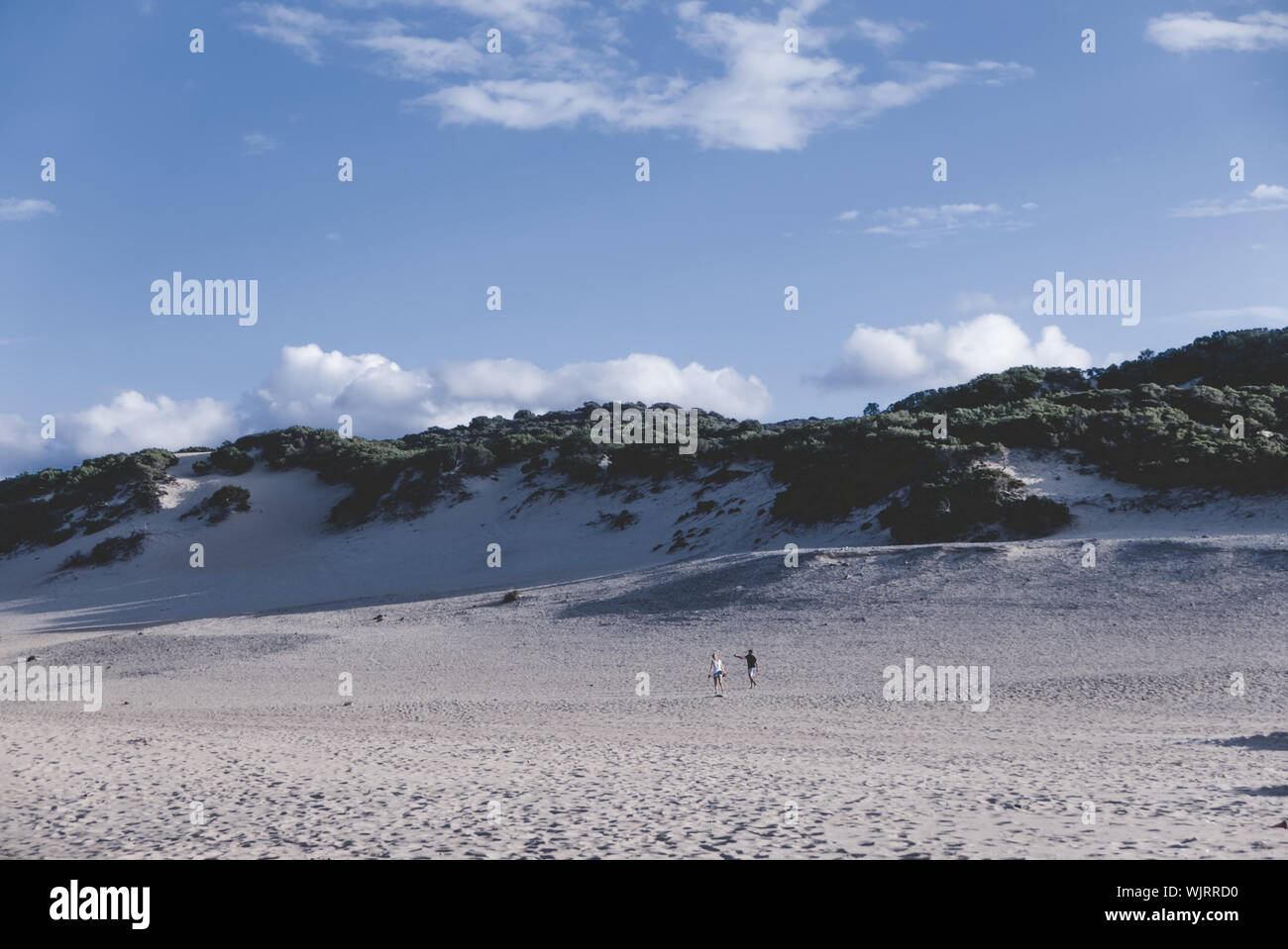 Sand Hill Against Sky At Desert On Sunny Day Stock Photo