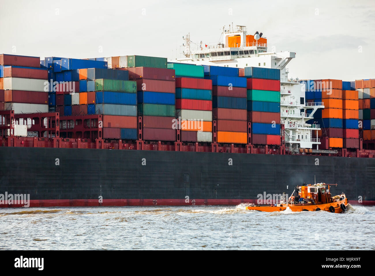 Fully laden container ship in port Stock Photo