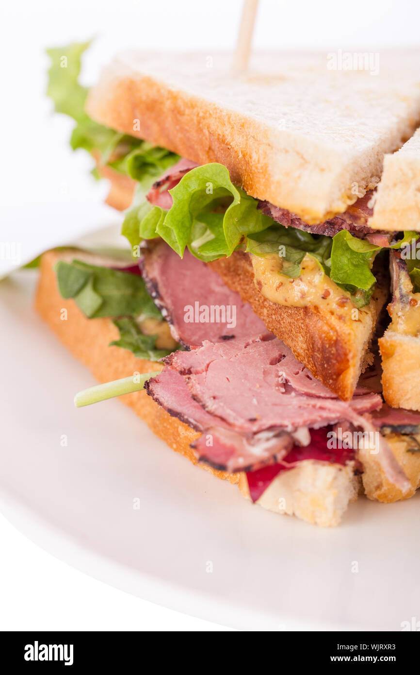 Delicious pastrami club sandwich and pickles Stock Photo Alamy