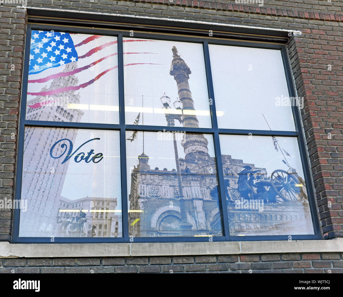 A window in the Cuyahoga County Archives building in Cleveland, Ohio, has one word, vote. Stock Photo