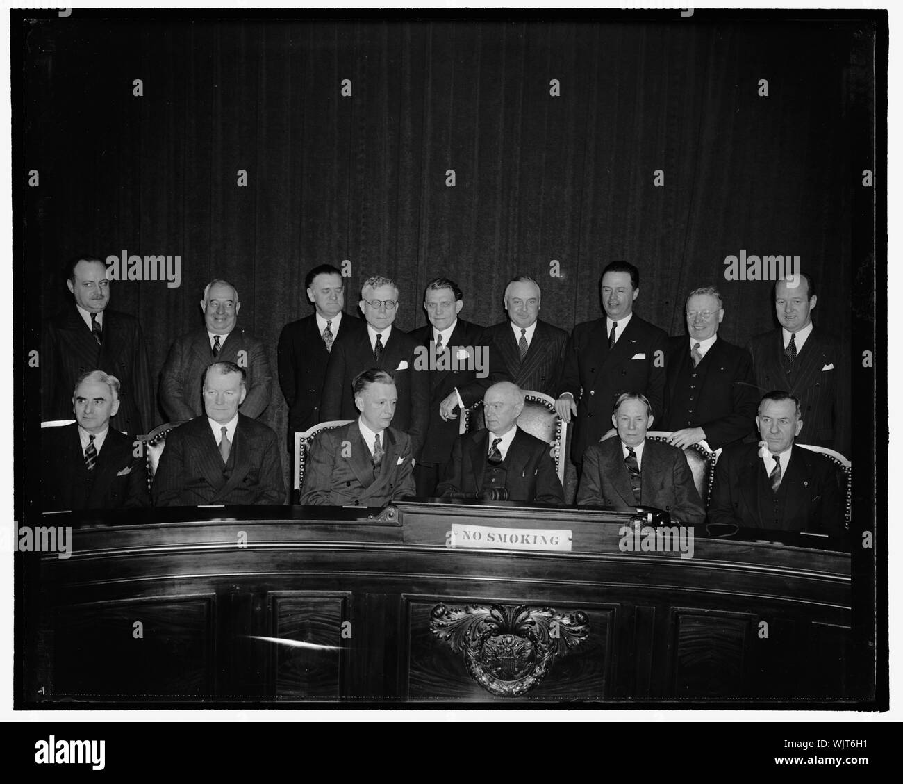 House Committee considers impeachment of Labor Secretary. Washington, D.C., Jan. 25. The House Judiciary Committee today considered charges contained in an impeachment resolution presented yesterday by Rep. J Parnell Thomas, but postponed action until tomorrow. Members shown here are: Front row; Wallace E. Pierce, Charles F. McLaughlin, Francis E. Walter, Hatton Sumners, chairman of the Committee, Zebulon Weaver, Raymond S. Springer; Back row; B.J. Monkiewicz, Louis E. Graham, John W. Gwynne, Earl Michener, U.S. Guyer, Abe Murdock, Dave (E)? Satterfield, Jr. William T. Byrne, James M. Barnes, Stock Photo