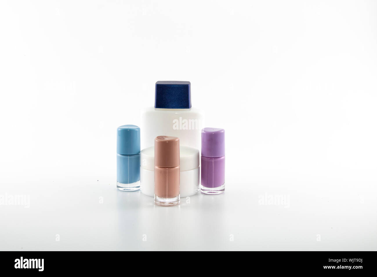 Set consisting of sun cream, parfum, nail polish, lotion. isolated
