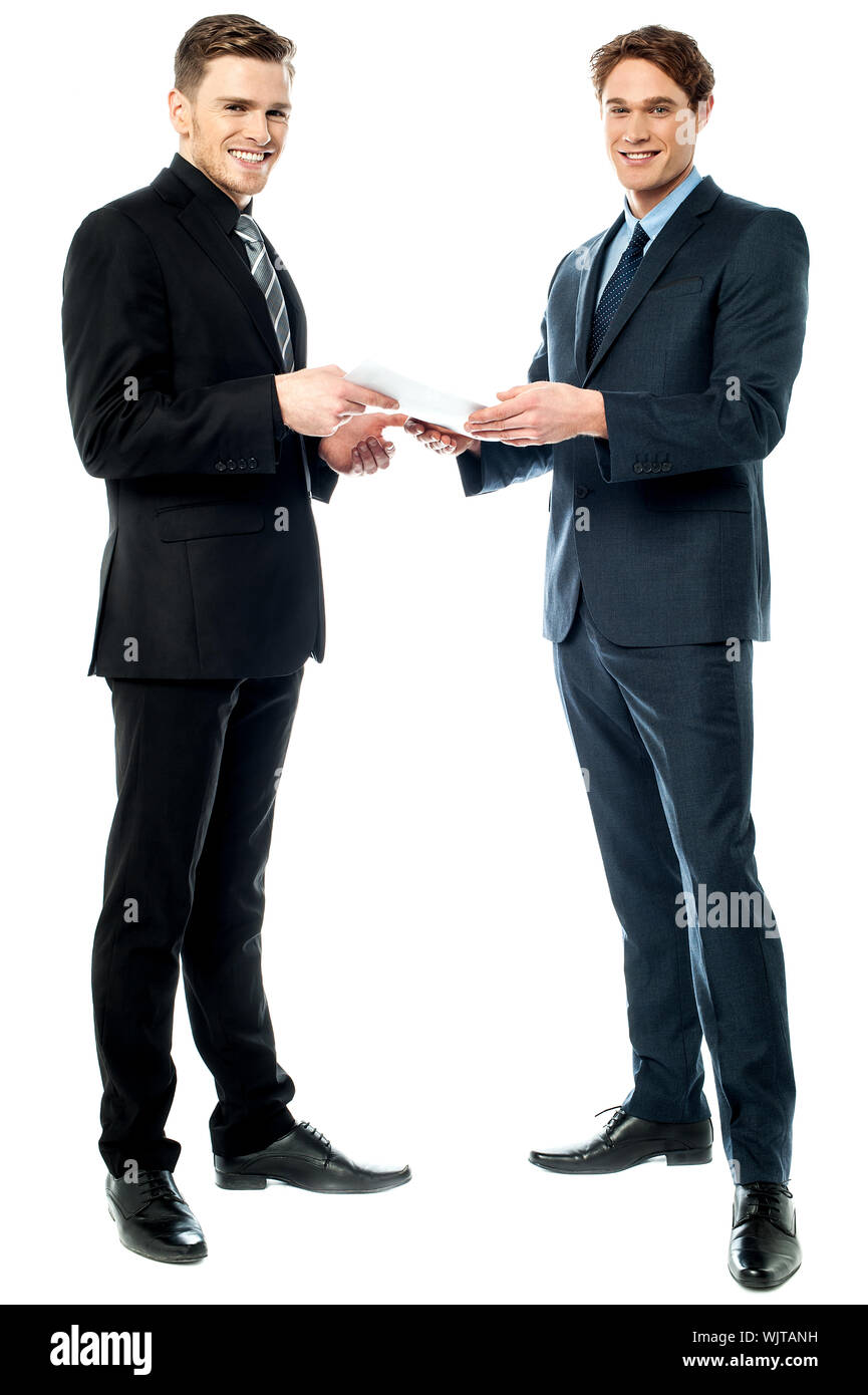 Business executives discussing the tender reports Stock Photo