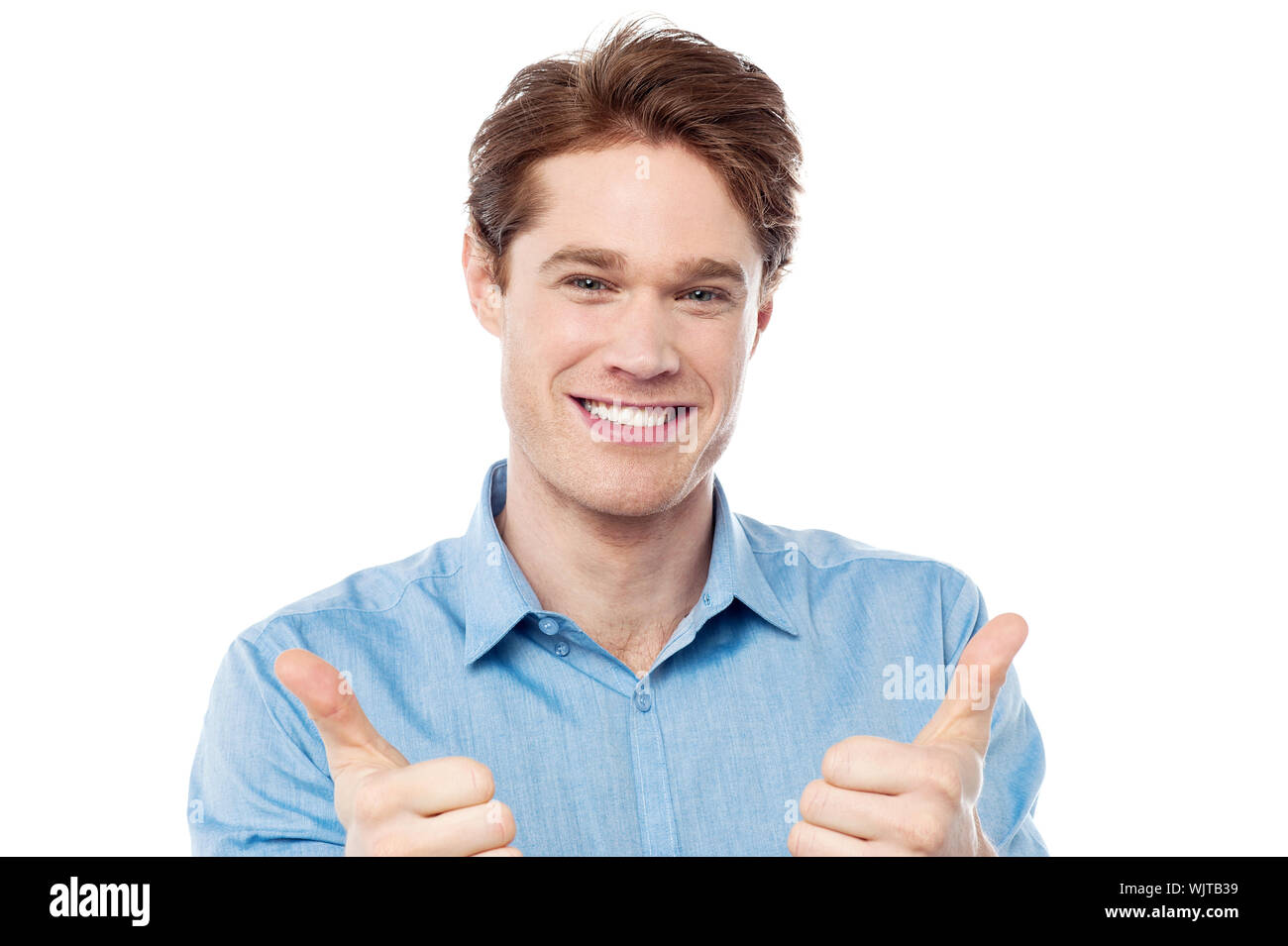 Cool young man showing double thumbs up Stock Photo Alamy