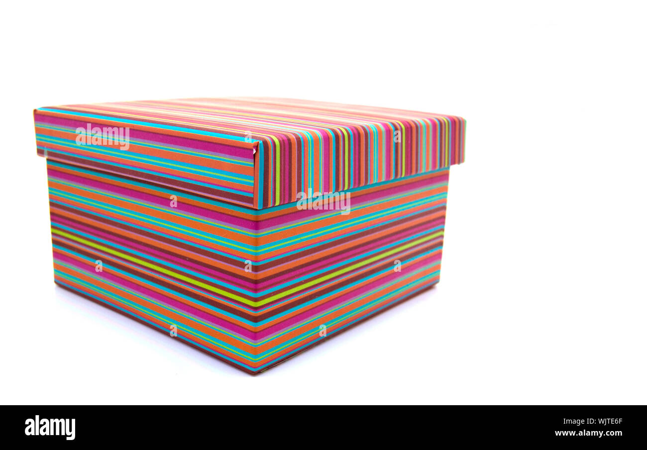 A colorful striped box on a white background Stock Photo - Alamy