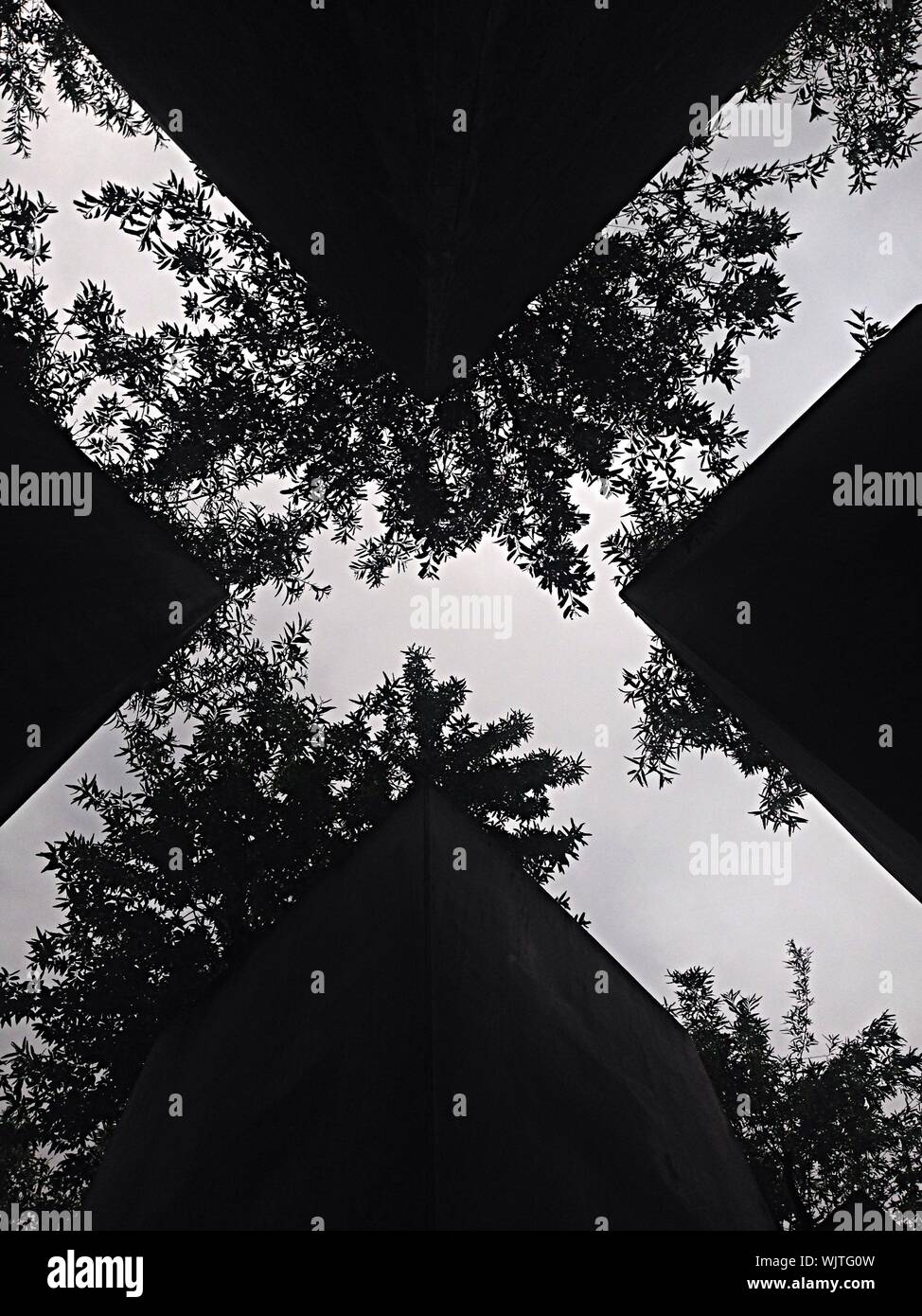 Upward View Of Built Structure Forming Cross Shape Negative Space Stock Photo