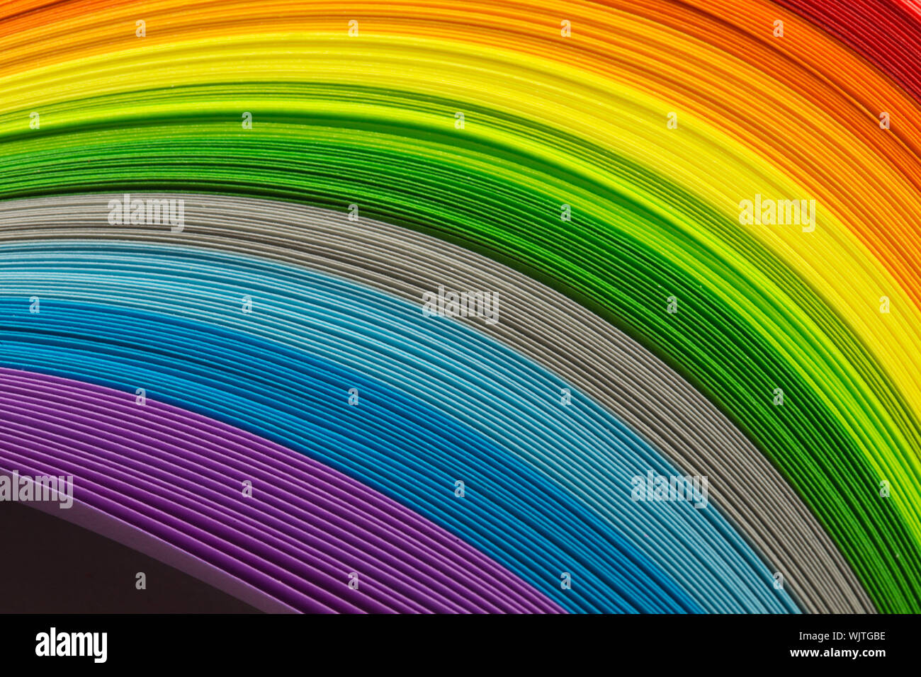 Paper strips in rainbow colors as a colorful backdrop Stock Photo - Alamy