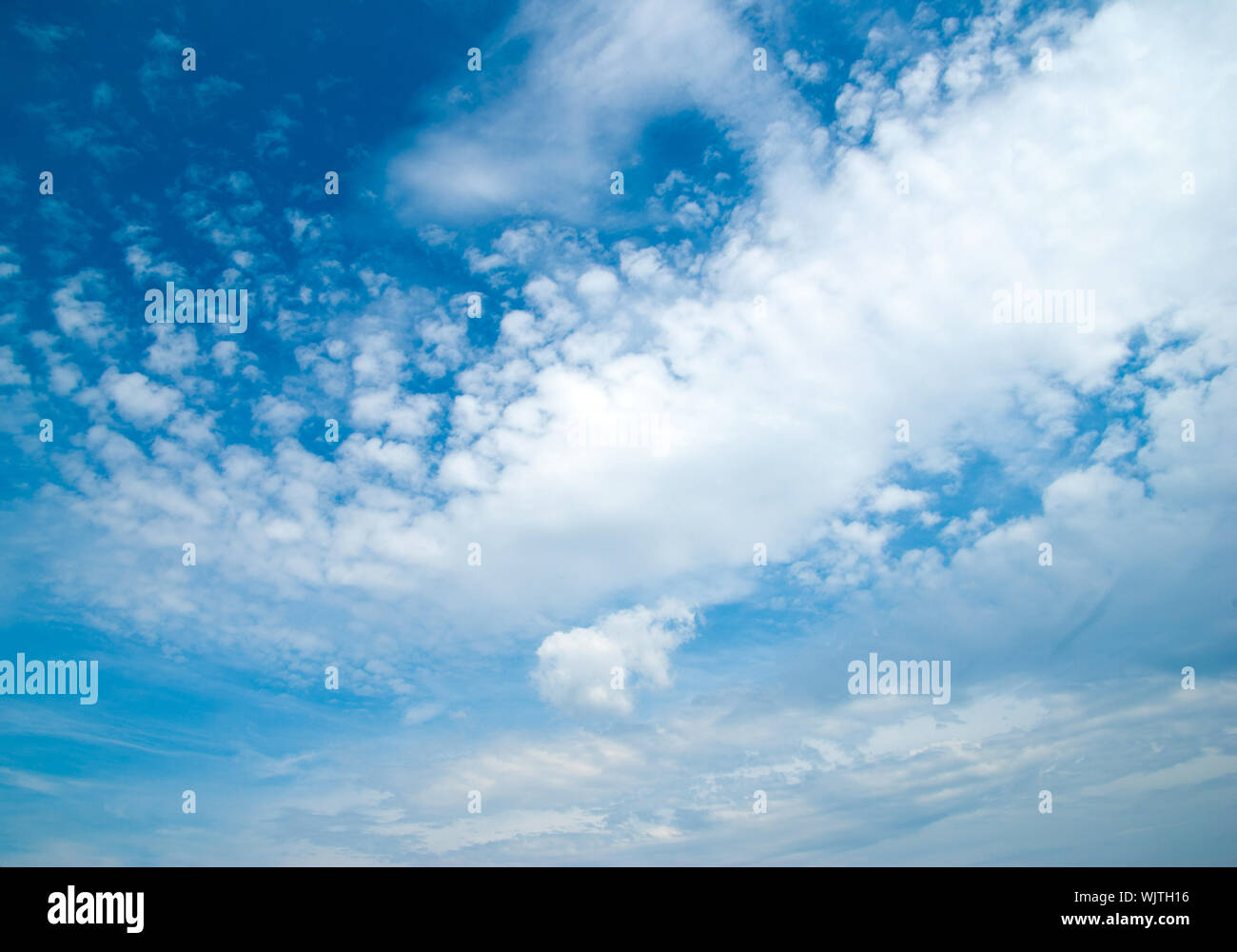blue sky background with tiny clouds Stock Photo Alamy