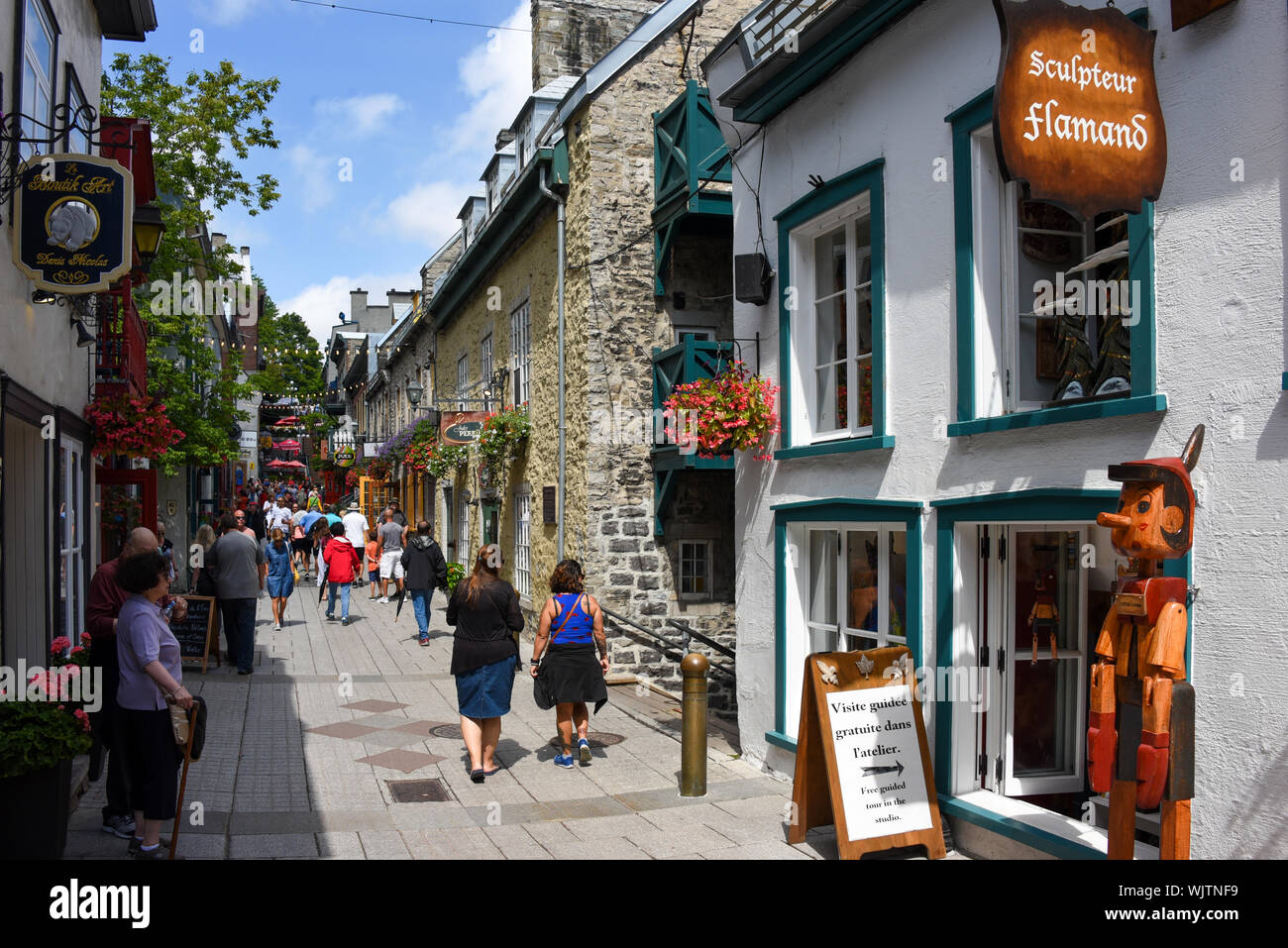 Quebec City, Canada - August 12, 2019: A crowd of people on the busy Quartier du Petit Champlain in old Quebec City.  It is claimed to be the oldest c Stock Photo