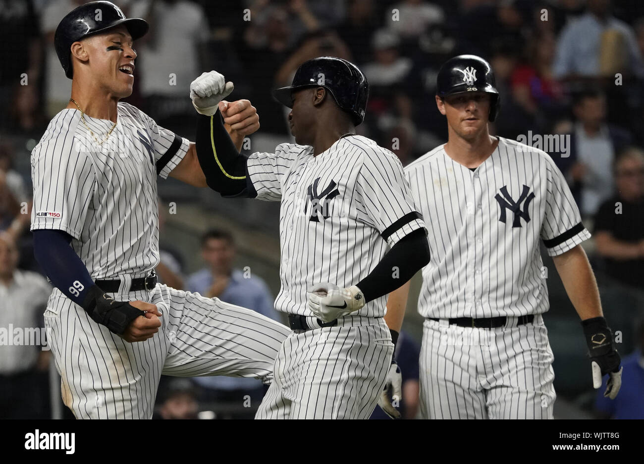 Bronx, United States. 03rd Sep, 2019. New York Yankees teammates Aaron Judge, Didi Gregorius and DJ LeMahieu (L to R) celebrate at the plate after Gregorius' three-run home run against the Texas Rangers in the sixth inning at Yankee Stadium in New York City on Sunday, September 3, 2019. Photo by Ray Stubblebine/UPI Credit: UPI/Alamy Live News Stock Photo
