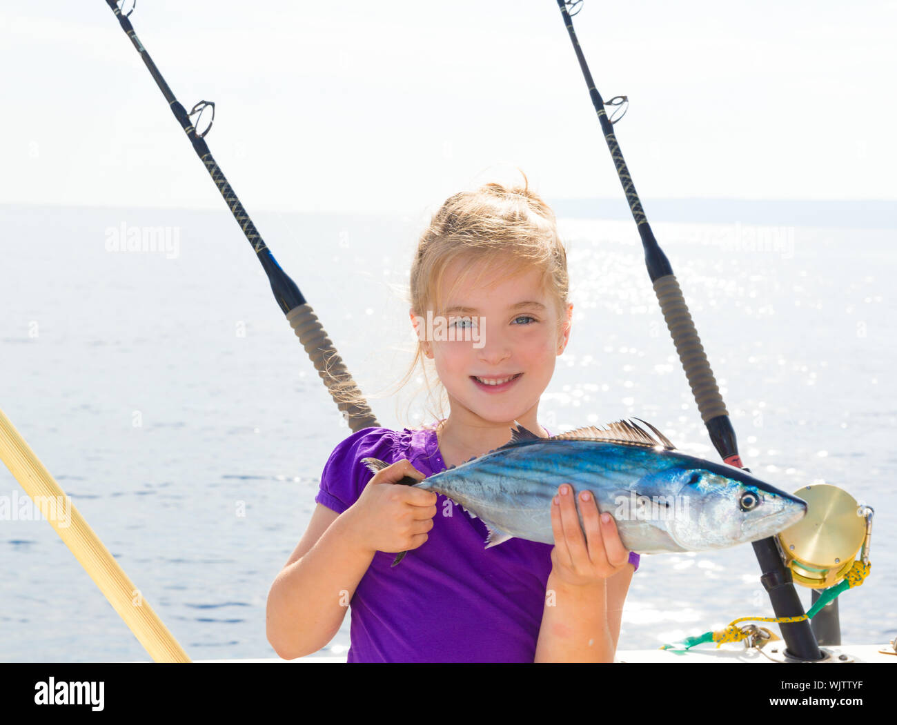 Blond girl fishing hi-res stock photography and images - Alamy