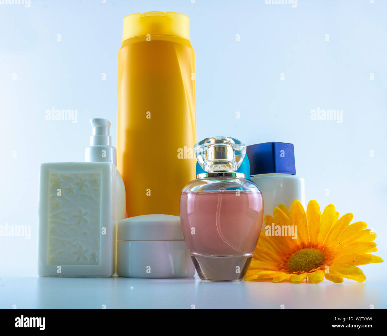 Set consisting of sun cream, parfum, nail polish, lotion. isolated. shot  white background Stock Photo - Alamy