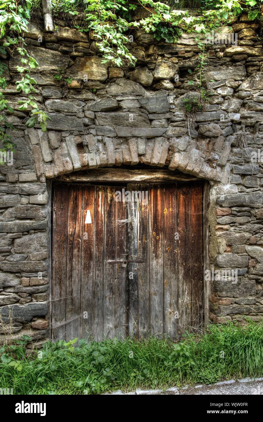 Old Wooden Door Of Stone Building Stock Photo - Alamy