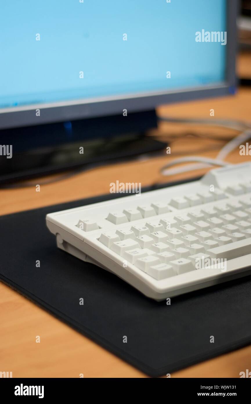 Keyboard and a part of lcd screen of a workstation Stock Photo