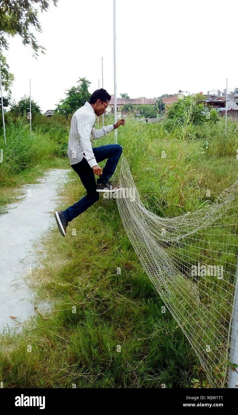 People jumping over fence hires stock photography and images Alamy