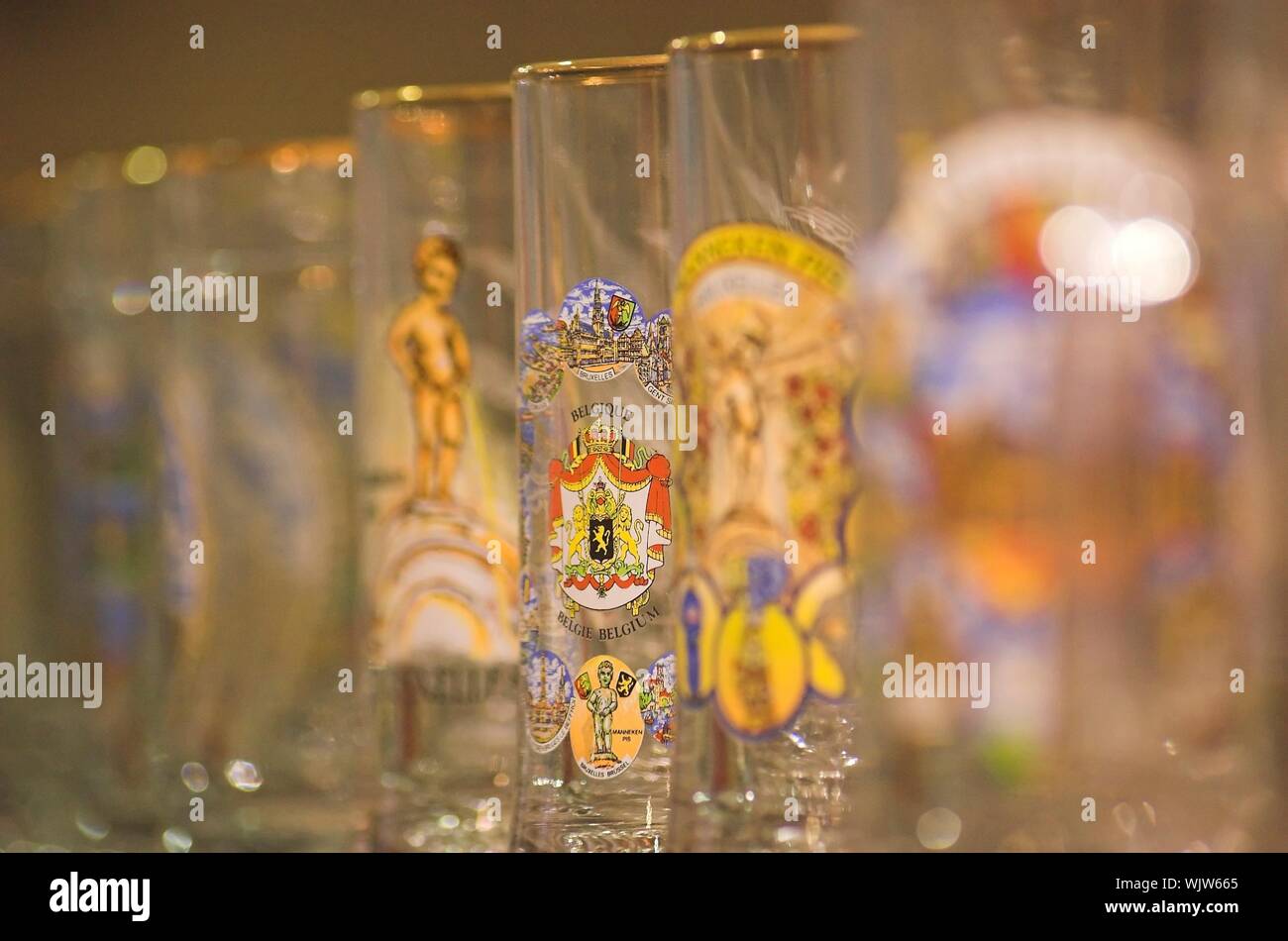 Belgian beer glasses on a shelf in a souvenir shop in Brussels Stock