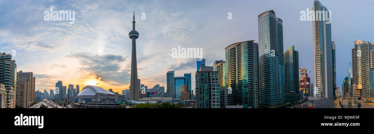 Cityscape panorama of downtown Toronto including iconic skyline features such as the Rogers Centre, CN Tower and Gardiner Expressway among more. Stock Photo