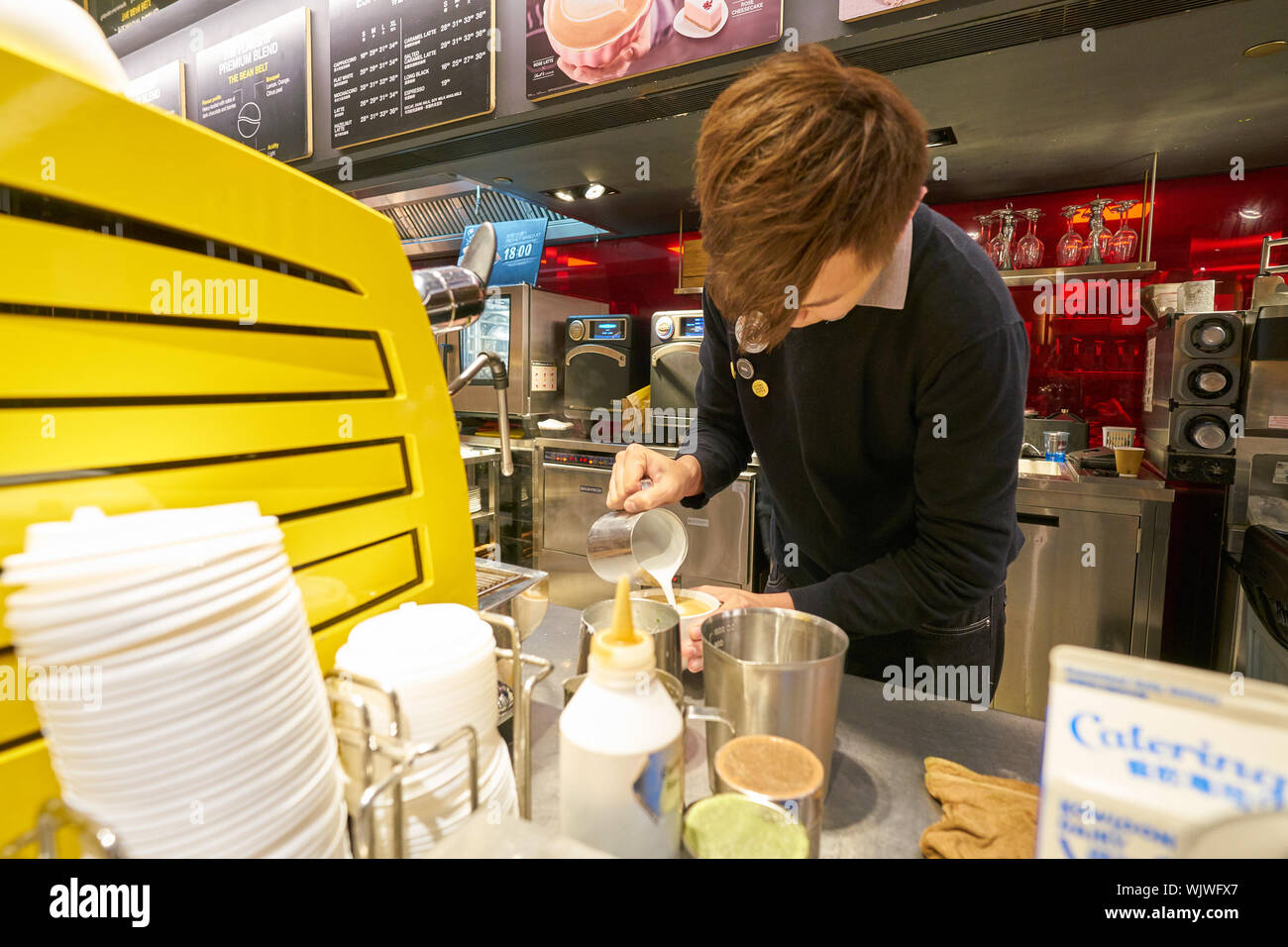 Mccafe Worker HONG KONG, CHINA - CIRCA FEBRUARY, 2019: worker preparing coffee at ...