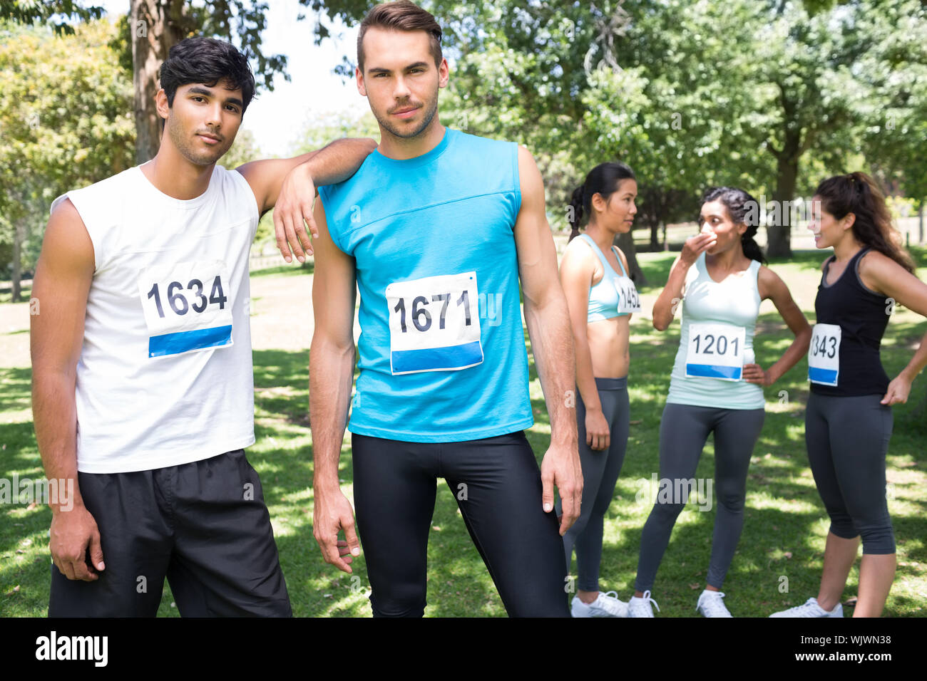 Male female runners standing hi-res stock photography and images - Alamy