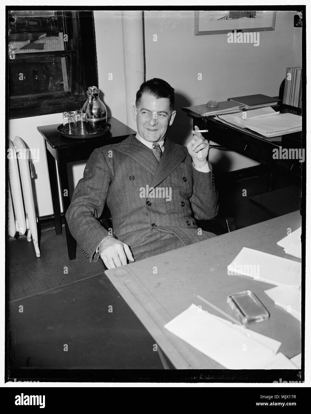 Hunter succeeds Aubrey Williams in WPA. Washington, D.C., Jan. 18. Howard O. Hunter, appointed Deputy Administrator of WPA by Col. F.C. Harrington today, succeeding Aubrey Williams. He will take up his new duties Feb. 1. He has been serving as a field representative in the middle west, and is here surveying with satisfaction the prospect of 'staying put' in his desk job, 1/18/39 Stock Photo