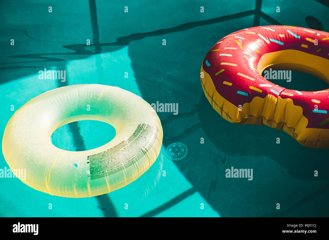 Inflatable Rings In Swimming Pool Stock Photo Alamy