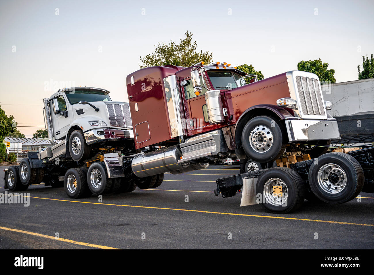 Big rig black powerful semi truck transports new semi trucks tractors