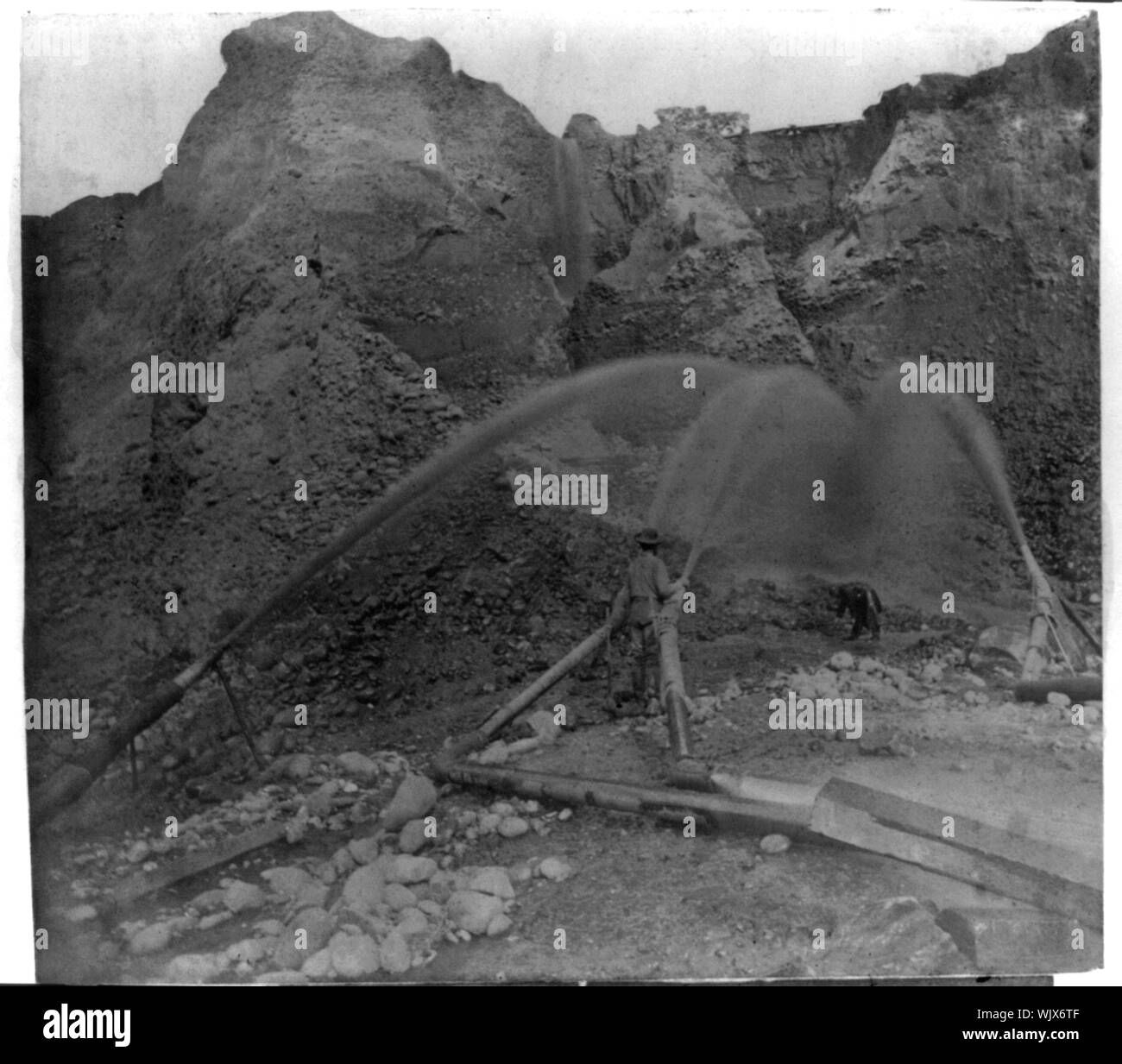 Hydraulic mining behind the pipes Stock Photo Alamy