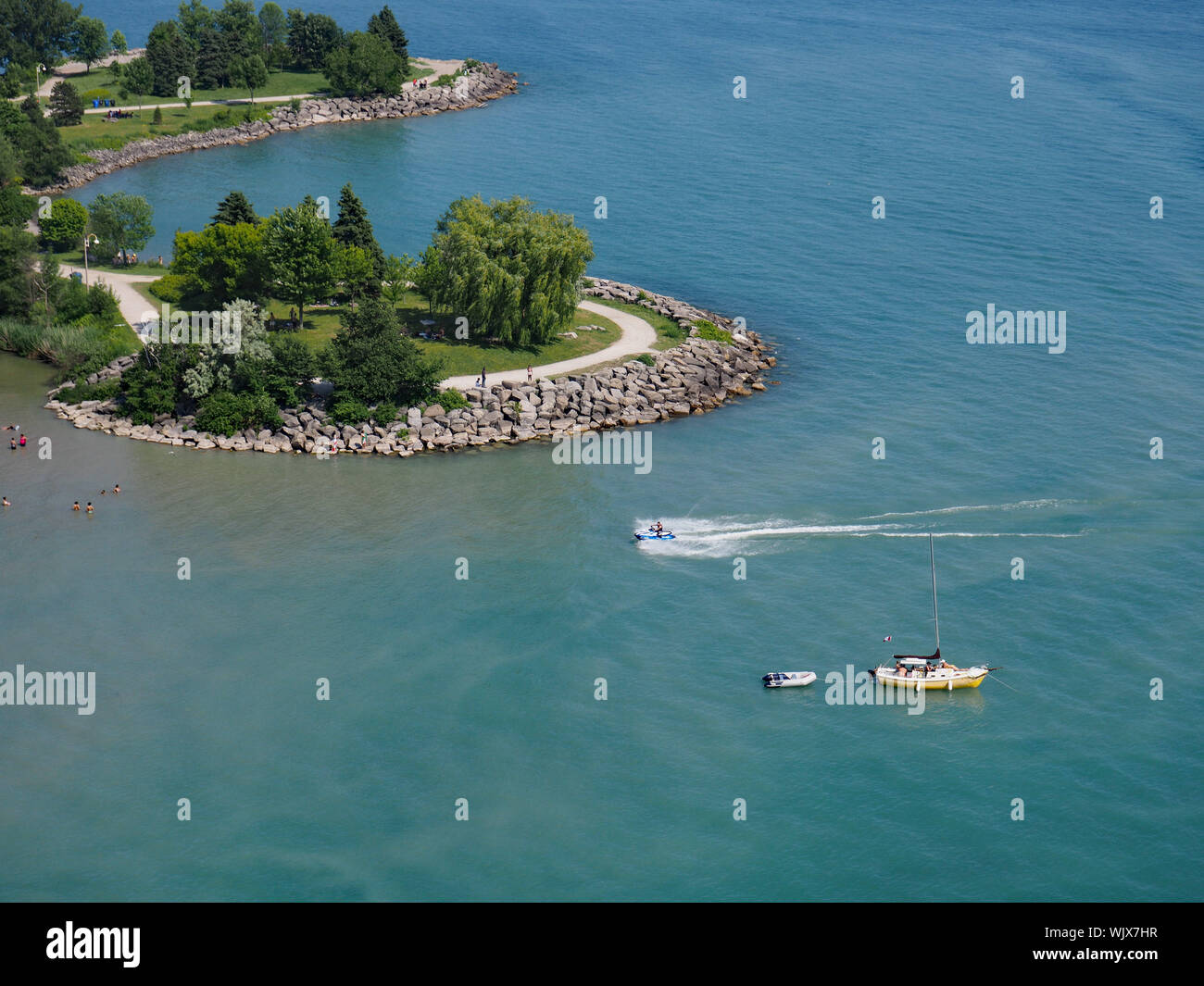 TORONTO - JULY 2018:  The shallow lagoons on the edges of Lake Ontario near the Scarborough Bluffs are popular locations for swimming and boating. Stock Photo