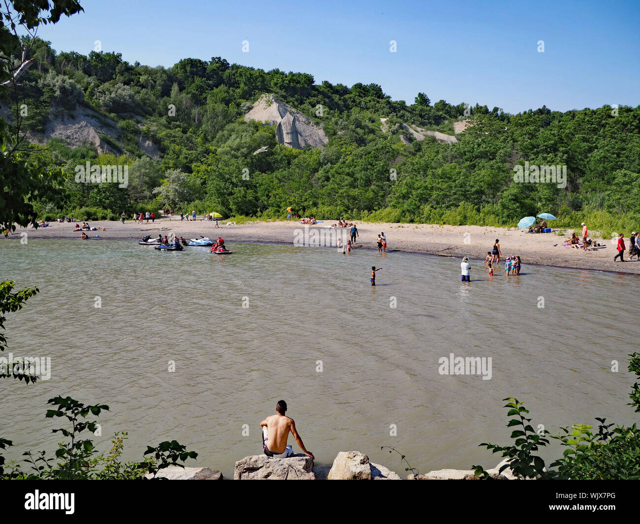 TORONTO - JULY 2018:  The shallow lagoons on the edges of Lake Ontario near the Scarborough Bluffs are popular locations for swimming and boating. Stock Photo