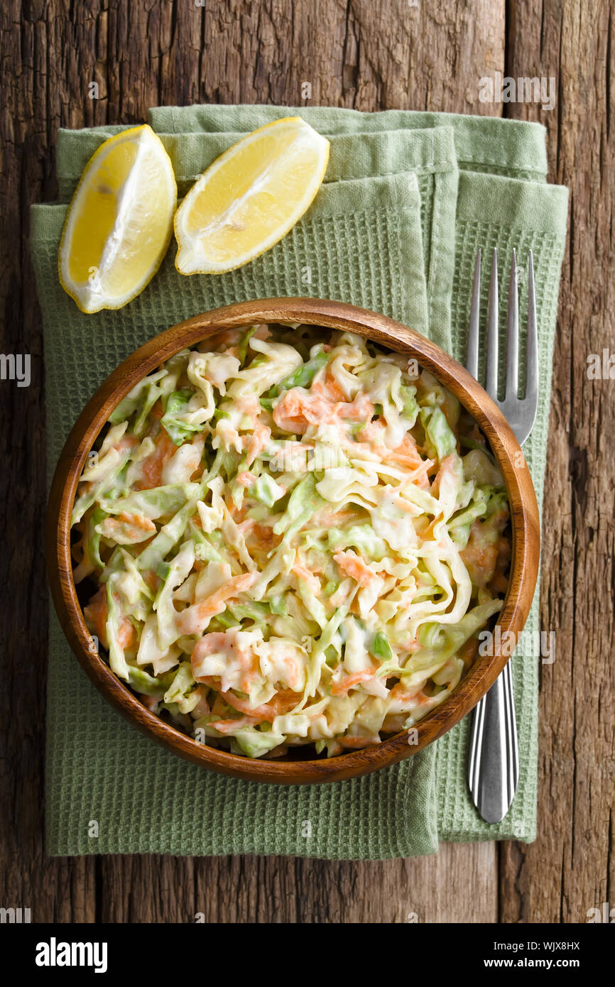 Coleslaw made of freshly shredded white cabbage and grated carrot with