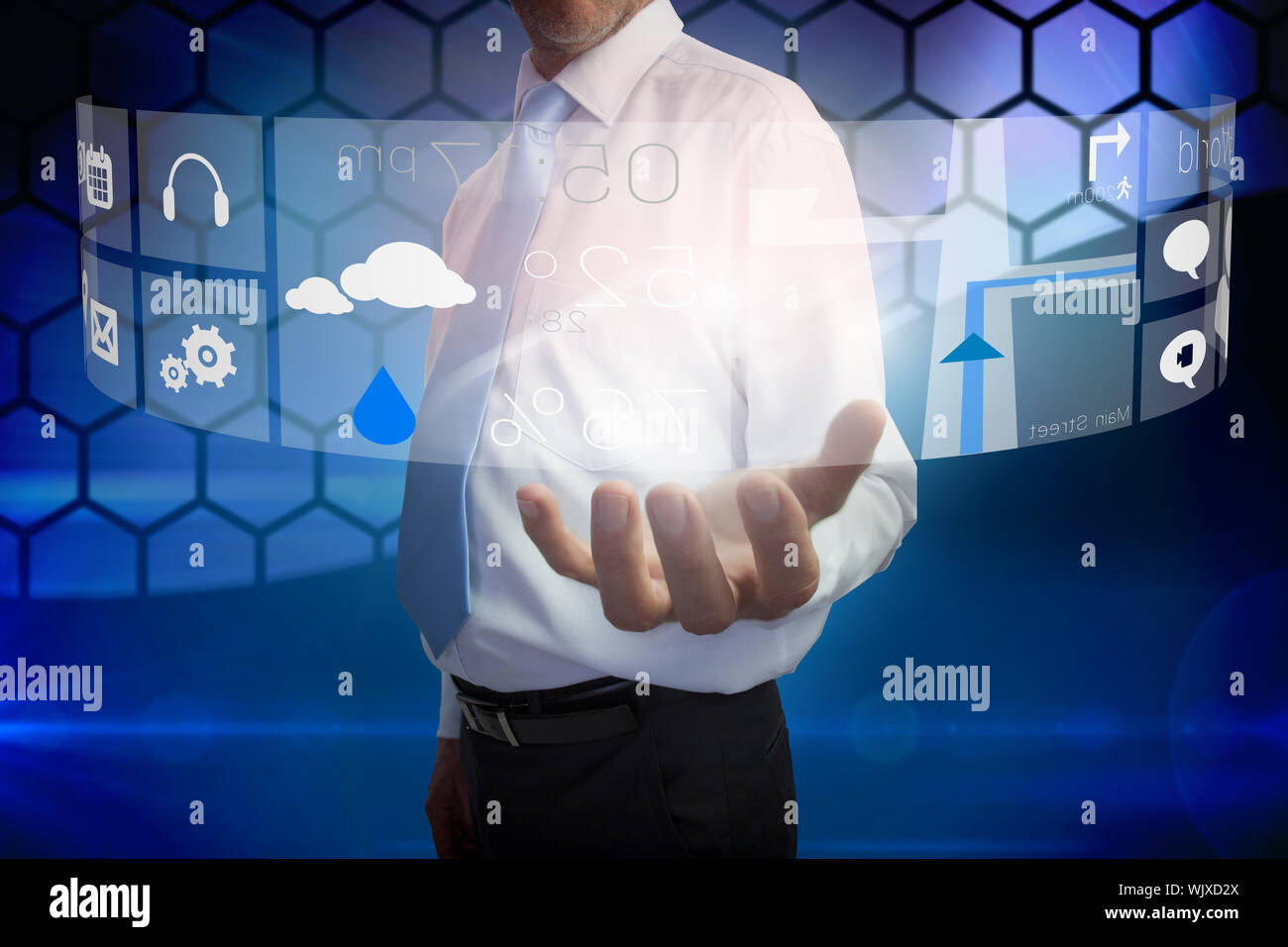 Digital composite of businessman presenting interface Stock Photo
