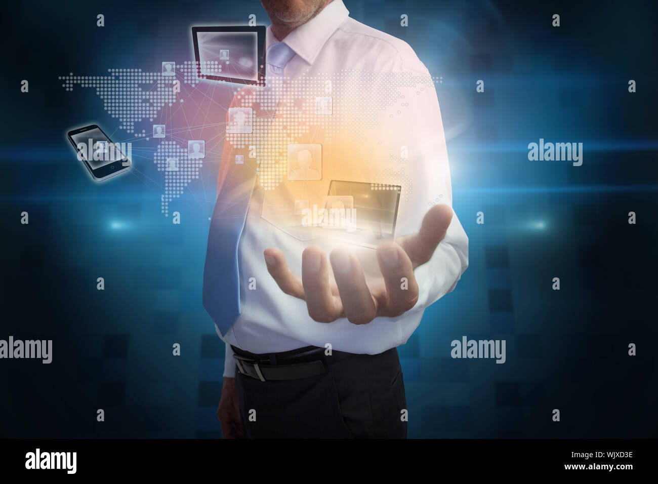 Digital composite of businessman presenting interface with connecting devices Stock Photo