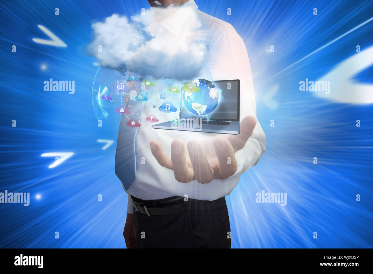Digital composite of businessman presenting app icons and laptop with cloud Stock Photo