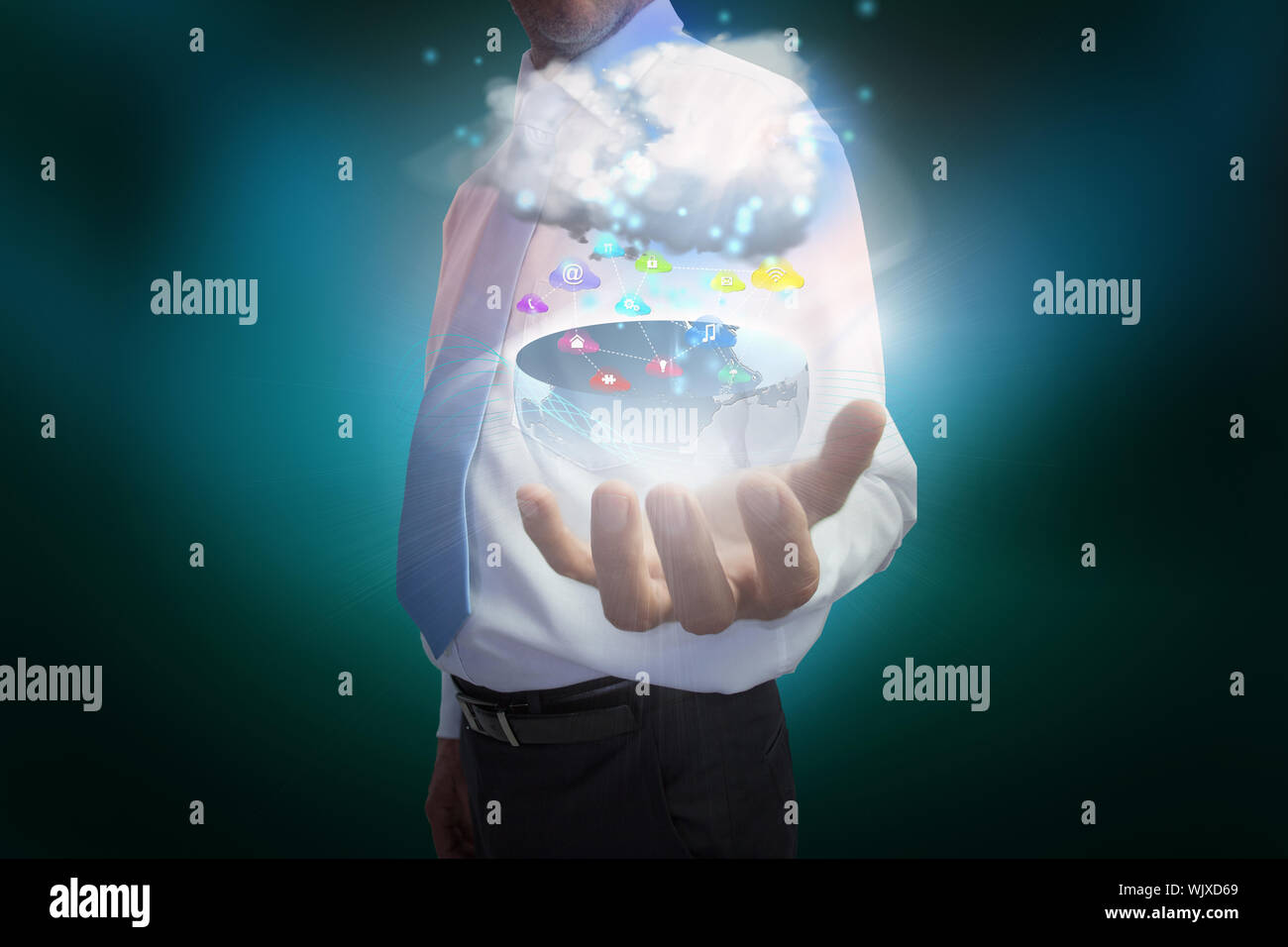 Digital composite of businessman presenting earth with cloud and app icons Stock Photo