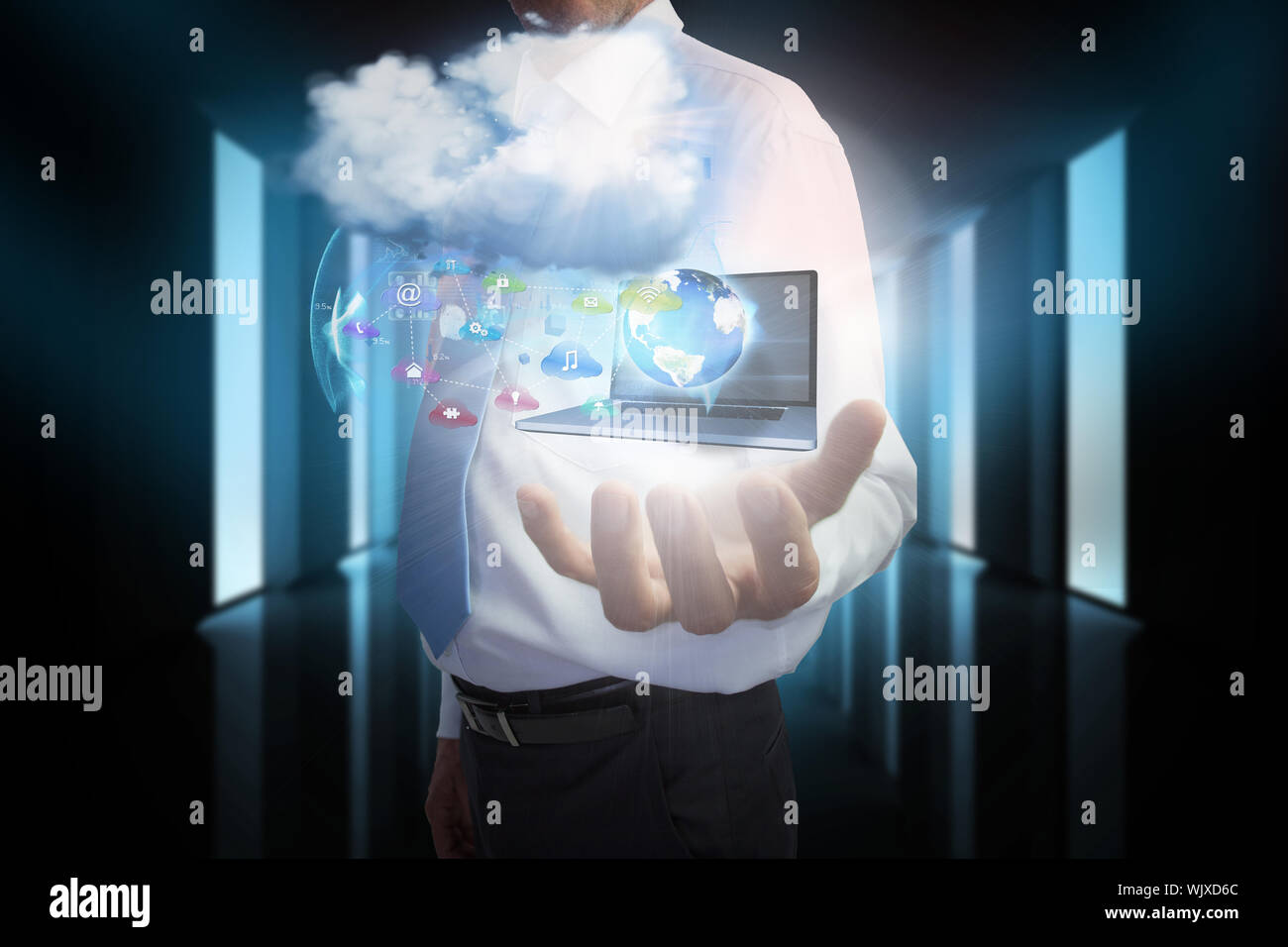 Digital composite of businessman presenting app icons and laptop with cloud Stock Photo