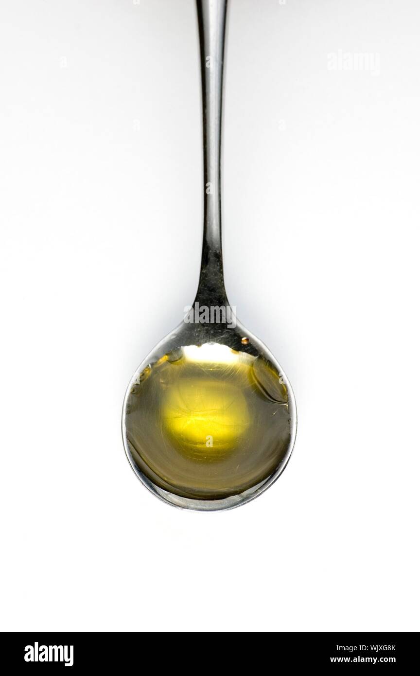 Teaspoon Of Olive Oil Isolated On White Stock Photo Alamy